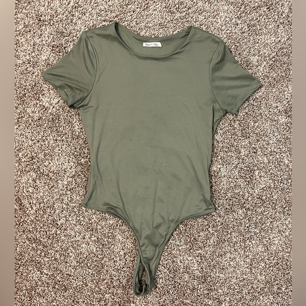 Very pretty hunter green. Body suit looks great with jeans or jean shorts.